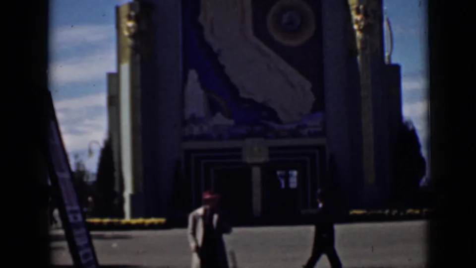1939 San Francisco exposition footage shows visitors crossing a plaza before an Art Deco pavilion with a California mural.
