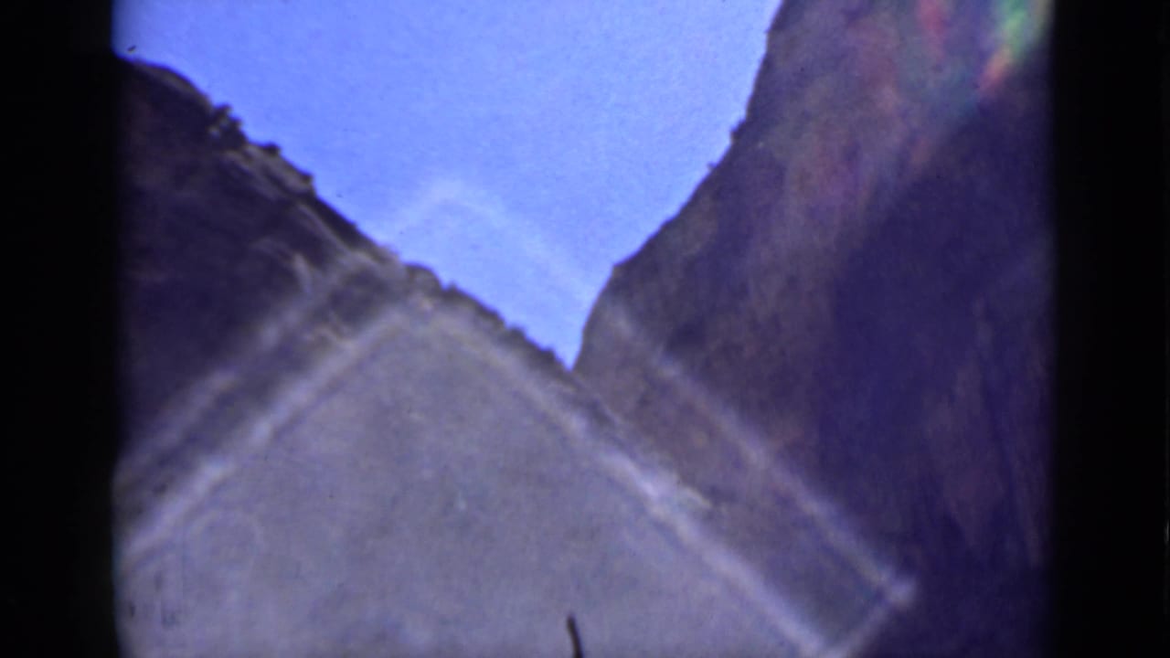The 1939 Utah footage shows a soft handheld view between canyon walls, with blue sky and pronounced diagonal glare.