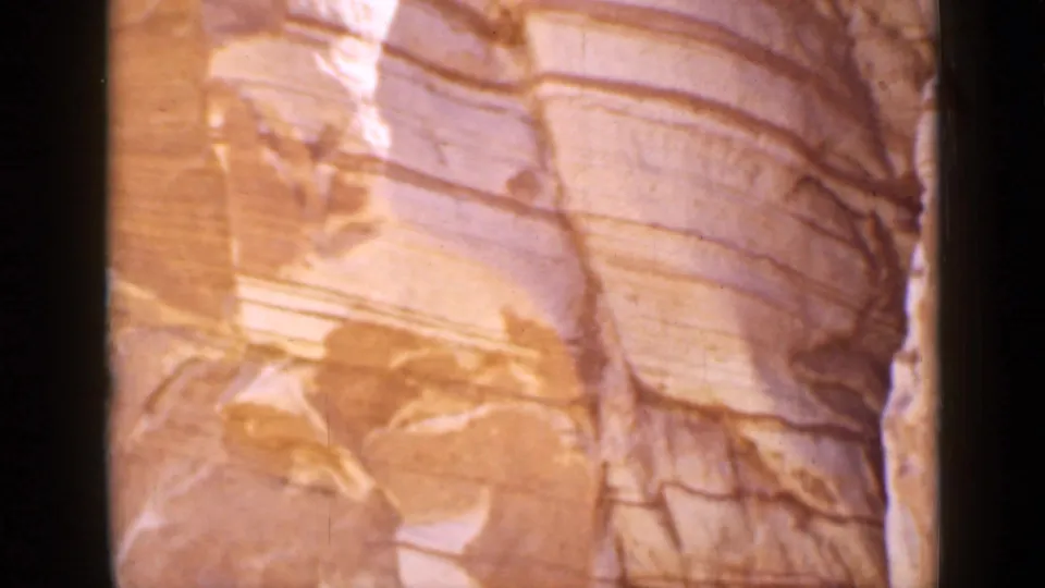 1939 Utah 8mm close-up of smooth layered sandstone strata in warm light.