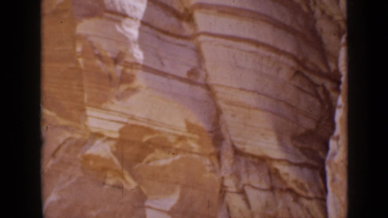 1939 Utah 8mm close view of a smooth sandstone wall with visible layered bands.