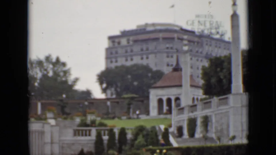 The Hotel General Brock appears in soft 8mm color behind trees, terraces, lawn, and a pavilion in Ontario.