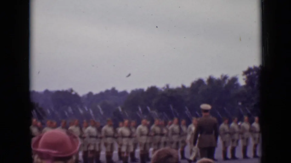 Ontario, Canada 1940 frame with an officer in a peaked cap before soldiers standing in formation with bayonets fixed.