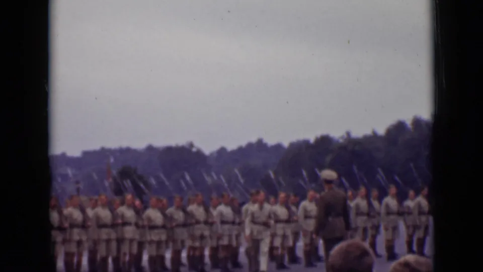 Ontario, Canada 1940 frame showing a uniformed officer near soldiers in formation, with bayonets visible above the ranks.