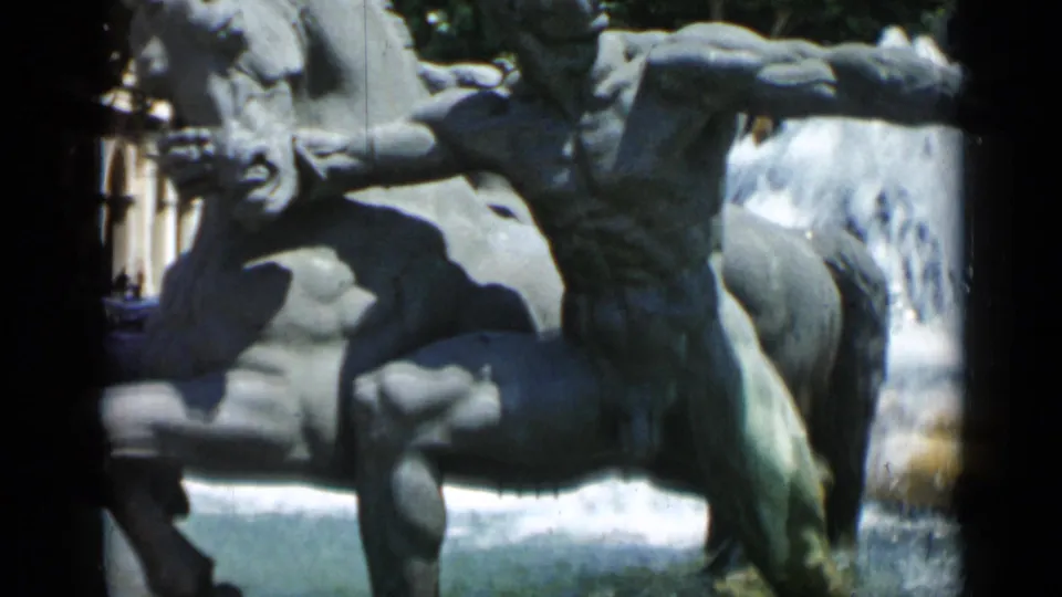 Close 1962 Cannes home-movie view of a fountain sculpture with figures and water spray.