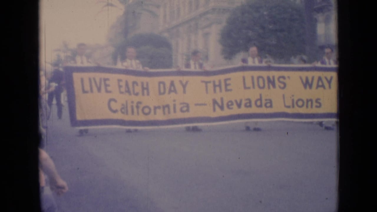 Large California-Nevada Lions banner fills the parade frame.