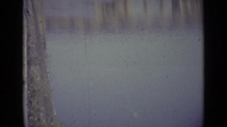1962 8mm Florence footage begins with a soft, partially obscured view of water and faint riverside architecture.