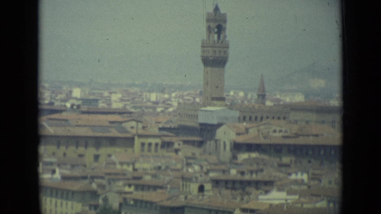 Florence skyline with the Palazzo Vecchio tower rising above rooftops.