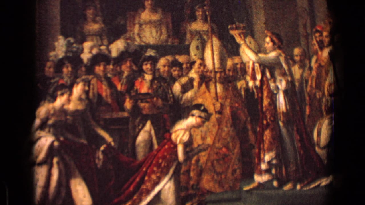 1962 Germany 8mm frame showing a painted or staged coronation scene with robed figures, onlookers, and a kneeling woman in red and white.