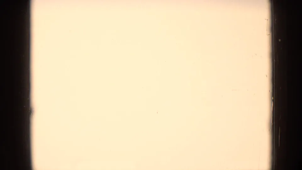 Mostly pale exposed 8mm frame with dark vertical gate edges, preceding the river-boat views in the 1962 Germany clip.