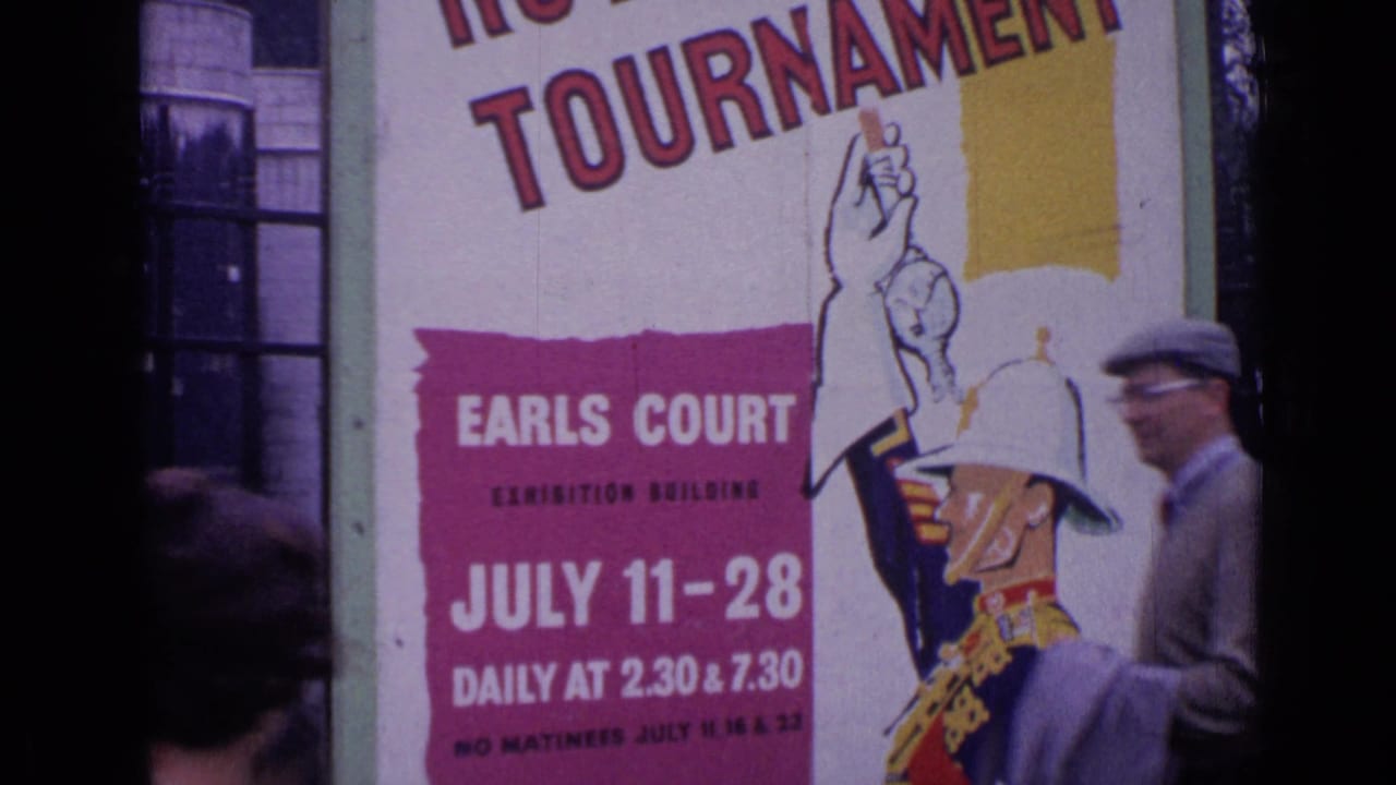 1962 London frame with a large Royal Tournament poster for Earls Court and a blurred passerby at the edge.