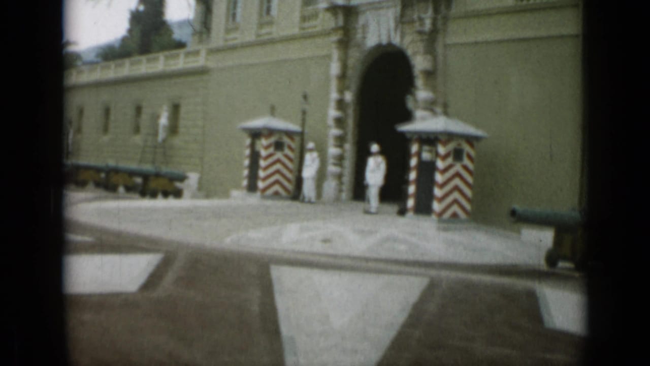 1962 Nice frame showing the guarded arched entry, striped sentry boxes, cannons along the wall, and a broad approach area.
