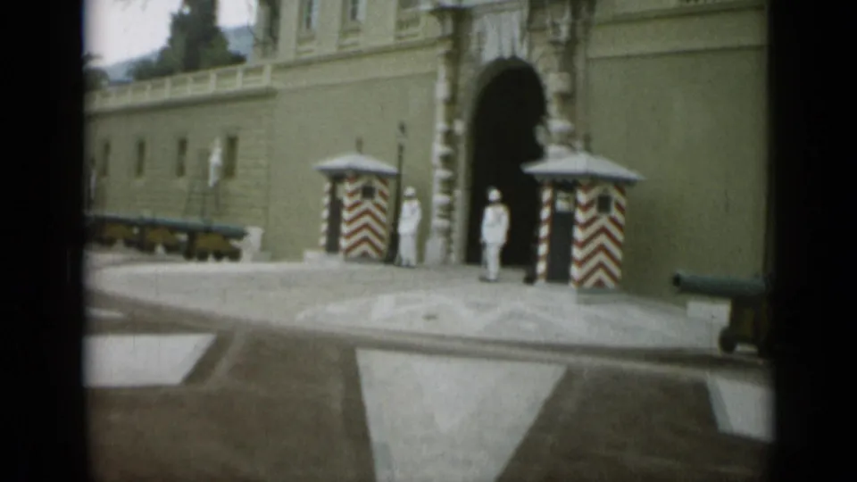 1962 Nice frame showing the guarded arched entry, striped sentry boxes, cannons along the wall, and a broad approach area.