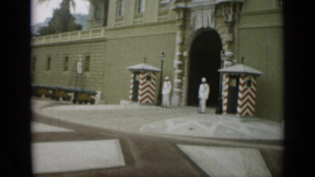 Closer 1962 Nice view of the ornate entrance, striped guard booths, uniformed attendants, cannons, and pale stonework.