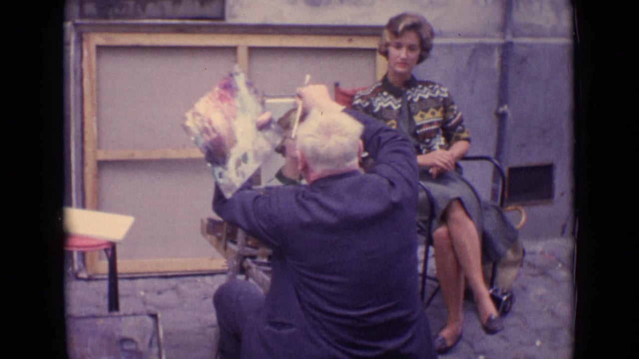 The Paris street artist works close to the canvas while the seated woman remains posed in a patterned sweater and skirt.