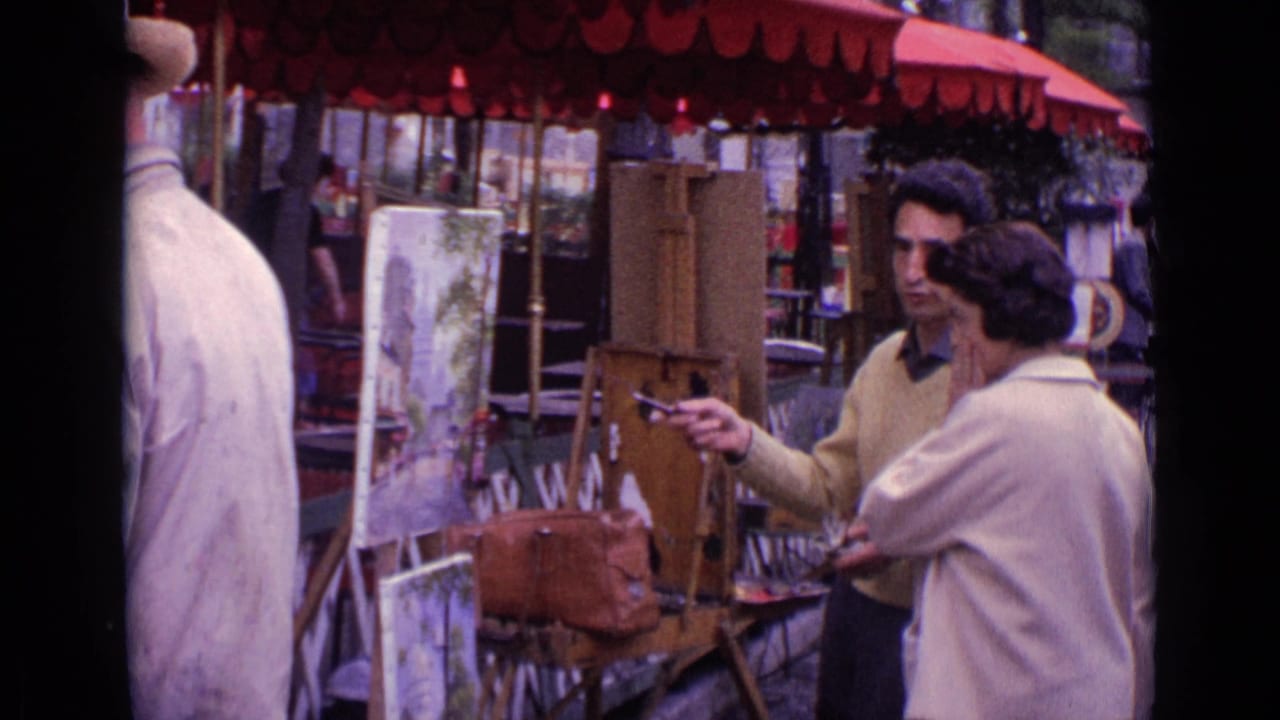 In 1962 Paris, adults stand near a street artist's easel under red scalloped market umbrellas, with canvases and chairs nearby.