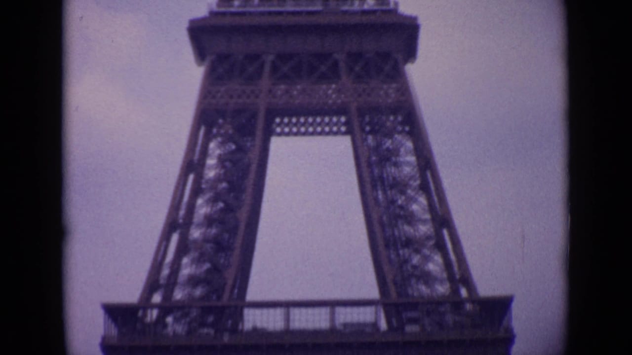 Low-angle view of Eiffel Tower ironwork and lower platform.