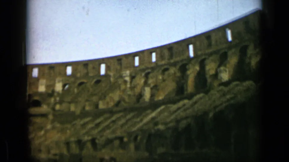 Handheld 1962 8mm footage shows the Colosseum's arched masonry and layered ruins from a visitor viewpoint.