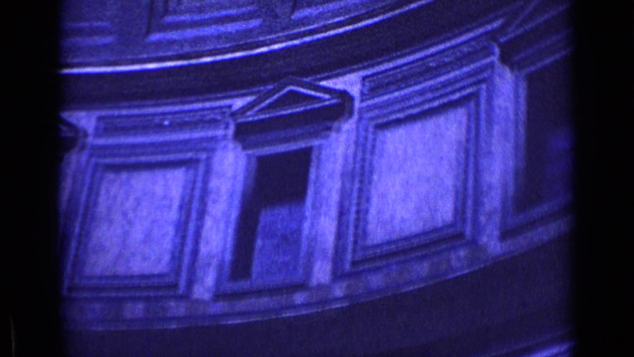 Close view of classical interior panels and trim with dark vertical borders.