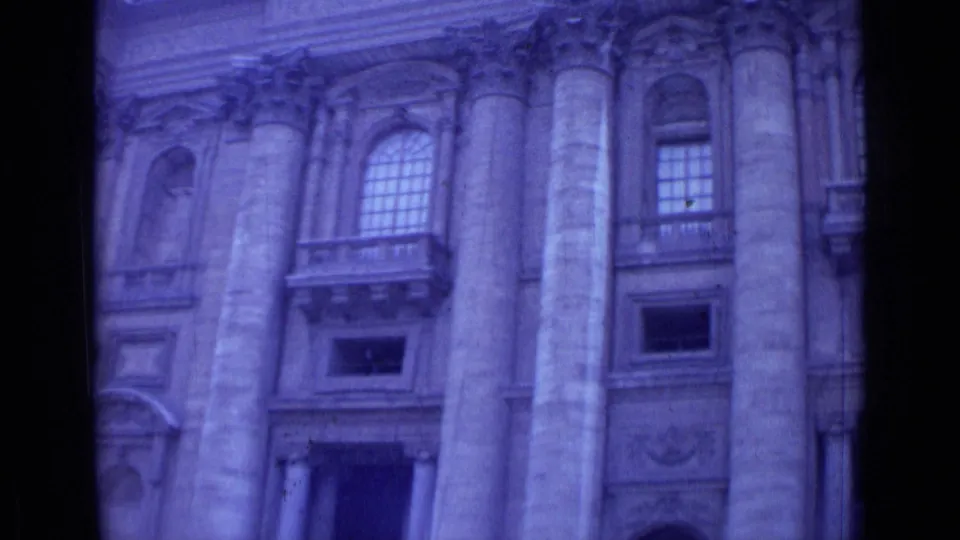 1962 Rome frame with a columned architectural facade, arched windows, carved trim, and visible contact-sheet border.