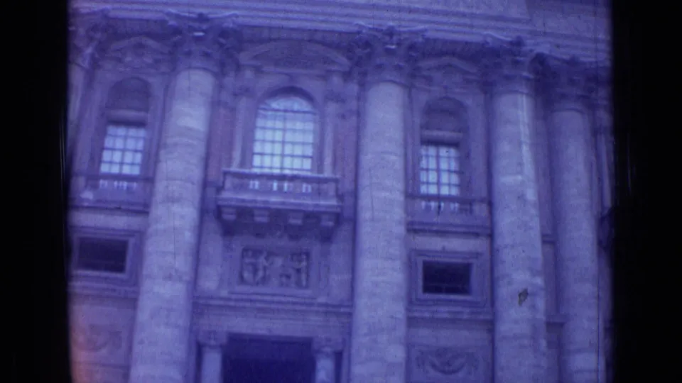 1962 Rome 8mm view of a monumental facade with columns, arched windows, and carved architectural details.