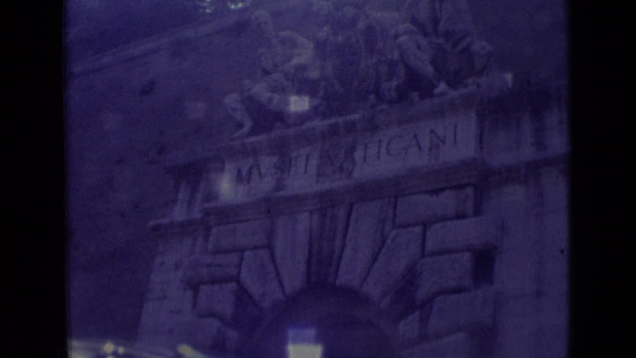 Musei Vaticani entrance arch with sculptural figures above the stone facade.