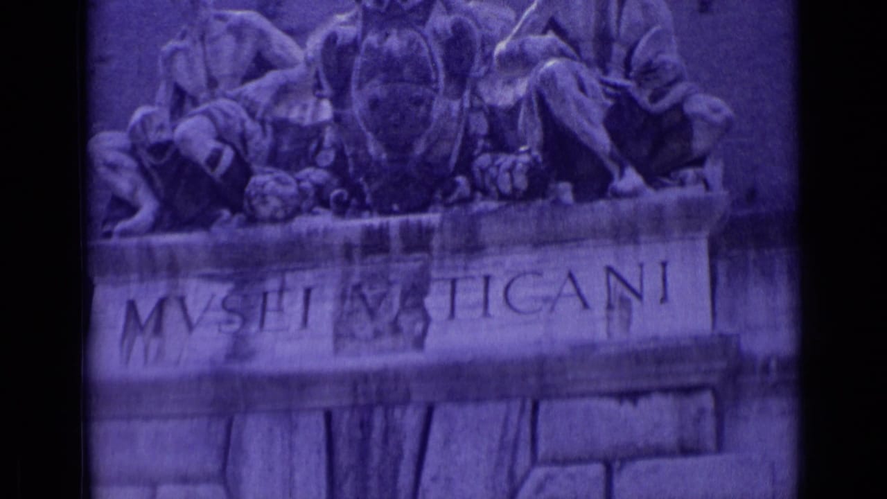 1962 Vatican City frame showing the Vatican Museums entrance sign and relief sculpture in purple-tinted 8mm footage.
