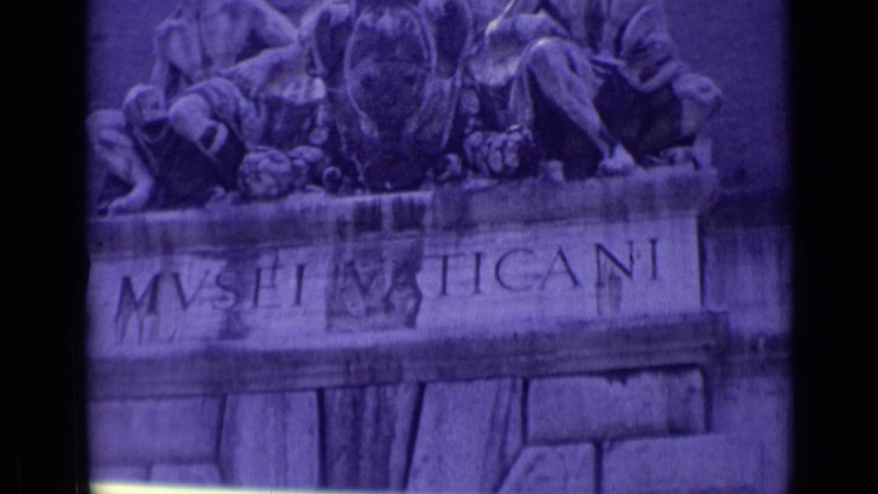 Purple-tinted 8mm view of the Vatican Museums entrance inscription, relief sculpture, and carved stone facade in Vatican City.