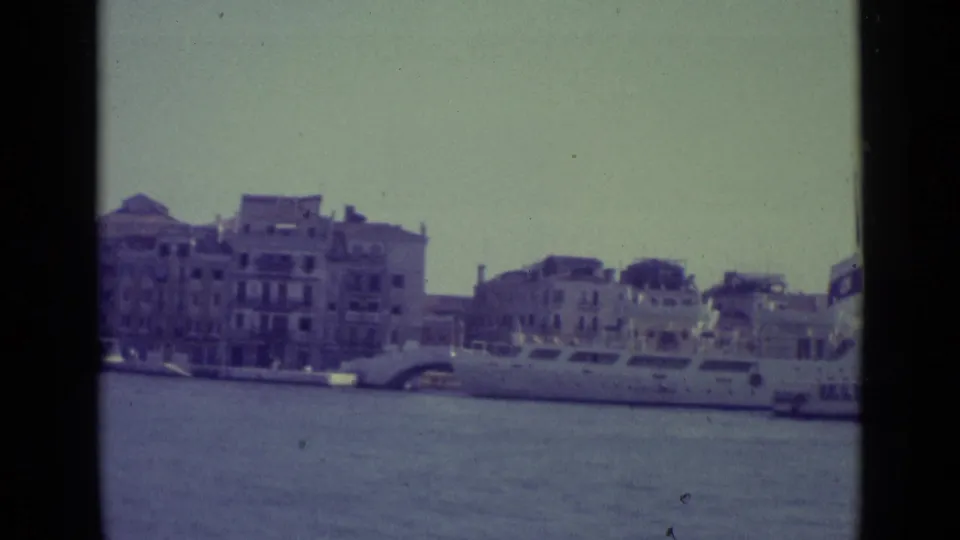 Venice Grand Canal view from 1962 showing a large passenger boat near pale waterfront buildings.