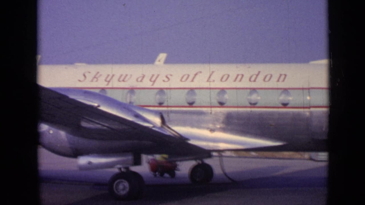 Skyways of London propeller aircraft parked on a tarmac with wing and landing gear visible.