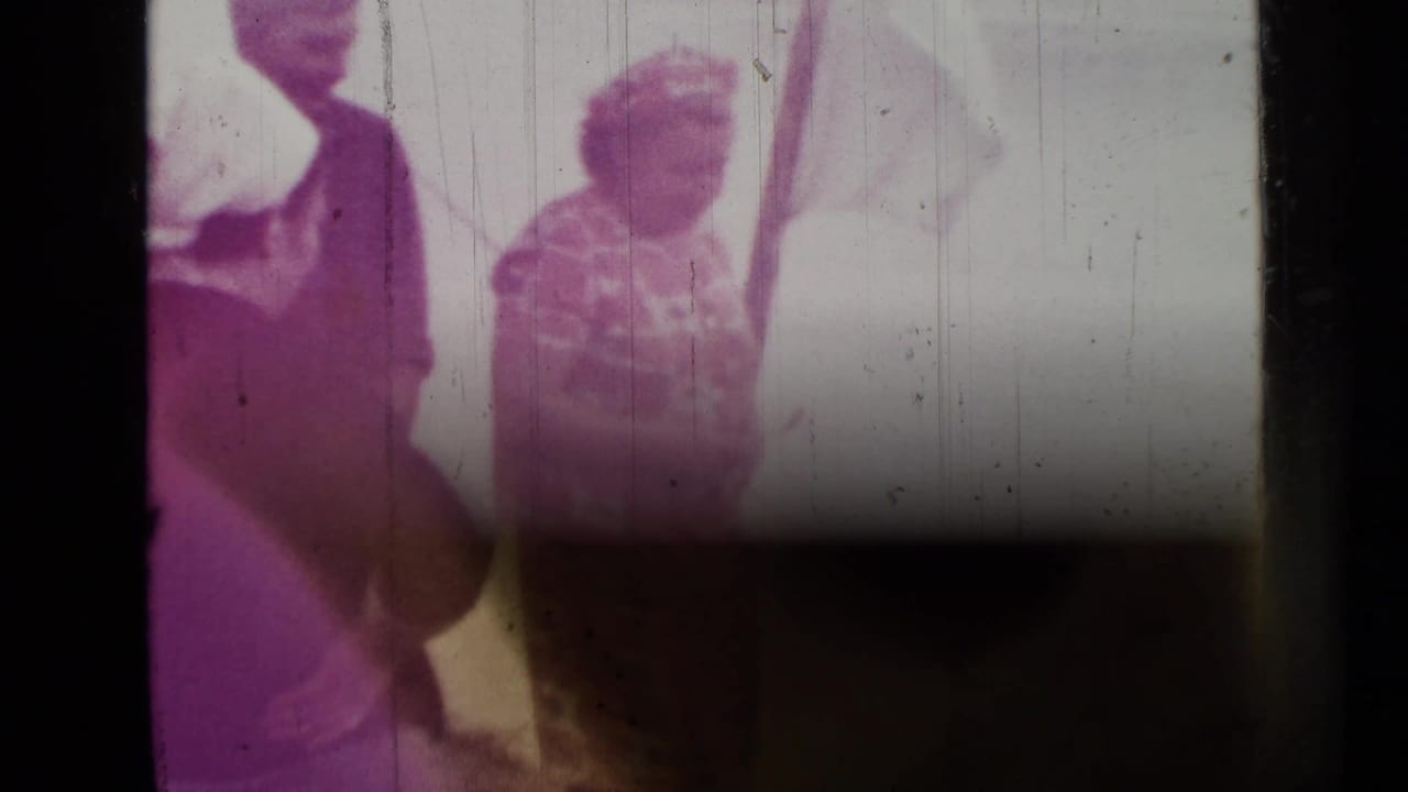 Faded 1967 Saint Petersburg home-movie frame showing two visible people near the outdoor cooking area.
