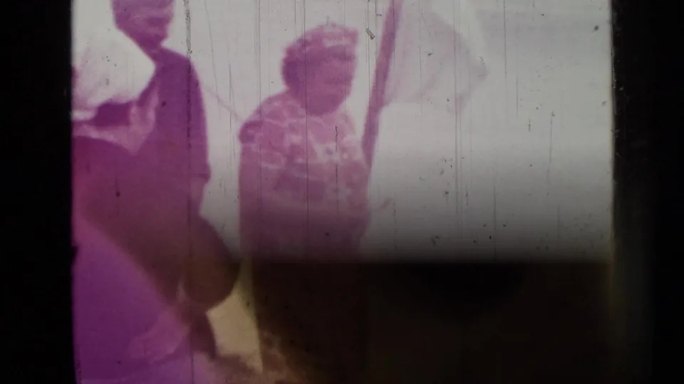 Faded 1967 Saint Petersburg home-movie frame showing two visible people near the outdoor cooking area.