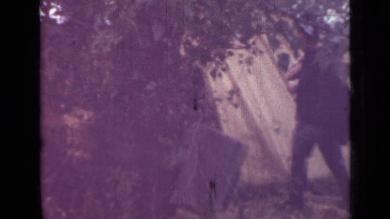 The closing 1967 camping frame shows a pale tent set under branches, with a partially visible adult near the right edge.