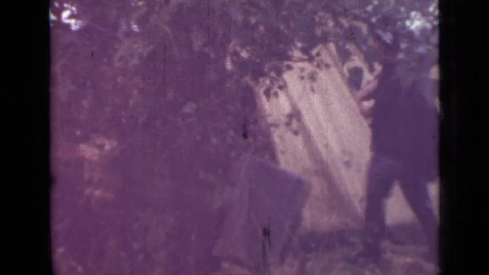 The closing 1967 camping frame shows a pale tent set under branches, with a partially visible adult near the right edge.