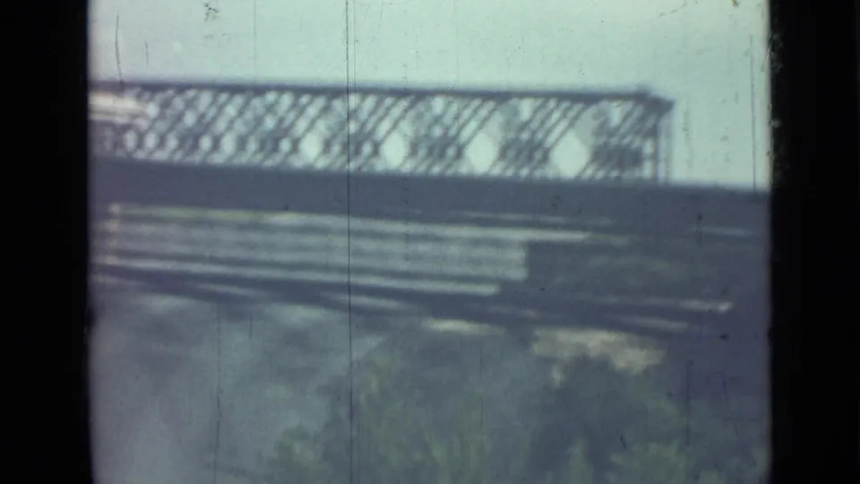 1967 Saint Petersburg travel footage showing a blurred exterior through a divided vehicle window, with railings and muted blue-gray light.