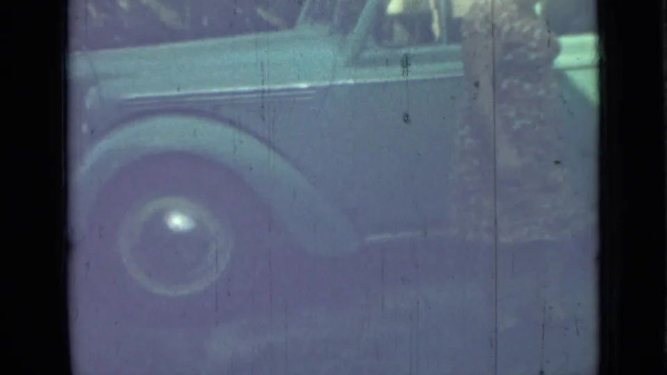 The final frame shows the side and rear wheel area of the blue sedan, with the woman partly cropped at the right edge.