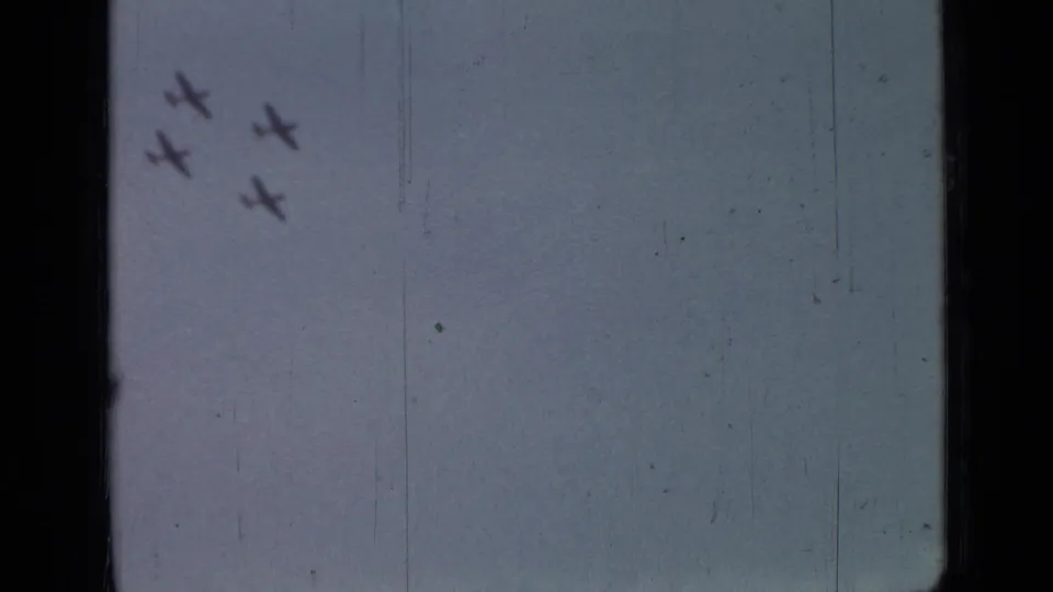 1967 Saint Petersburg 8mm frame showing four aircraft silhouettes in formation against a blue-gray sky.