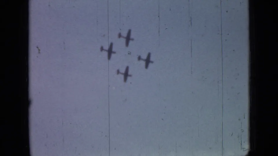 Four small aircraft appear high in a pale sky in 1967 Saint Petersburg home-movie footage.