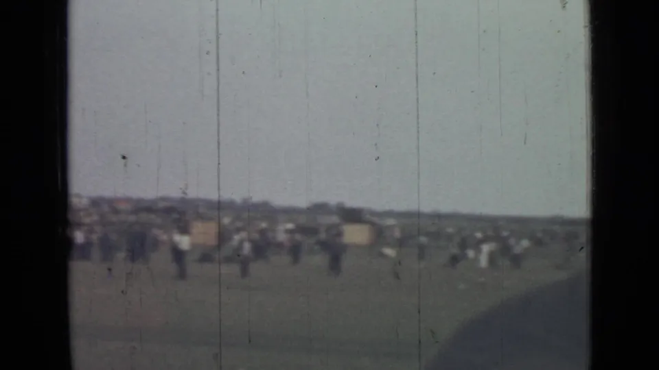 Wide Saint Petersburg field view from the supplied 1967 metadata, with distant people and a low bleacher-like line under a pale sky.