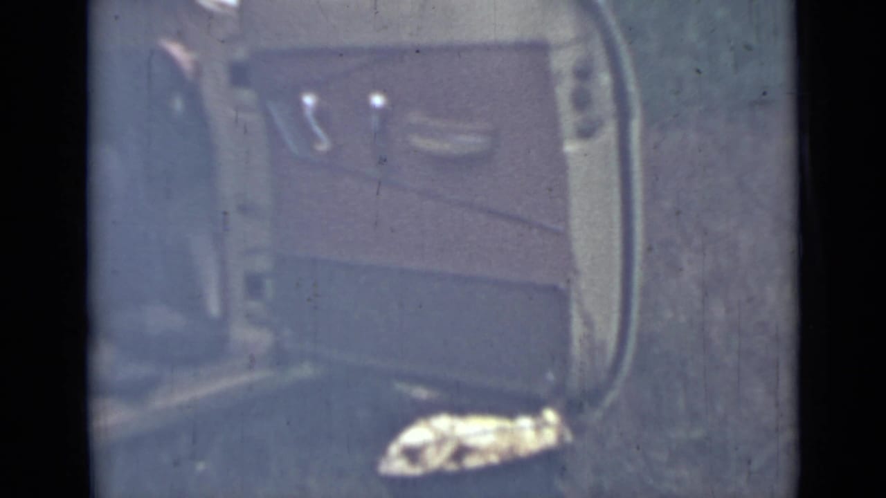 Close view of an open vehicle door with interior panel and window visible.