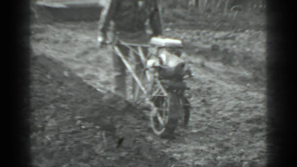 A rear view in the Moscow 1975 clip shows the man continuing to push the tiller across the garden soil.