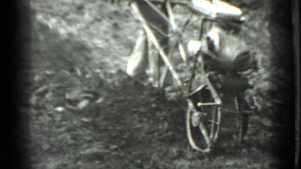 At close range, the man controls the one-wheel motorized tiller as it turns over soil in the 1975 Moscow garden scene.