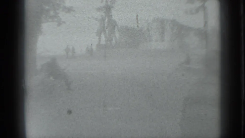 Washed-out 1983 Moscow park view with a vertical monument or fountain feature and indistinct people in the distance.