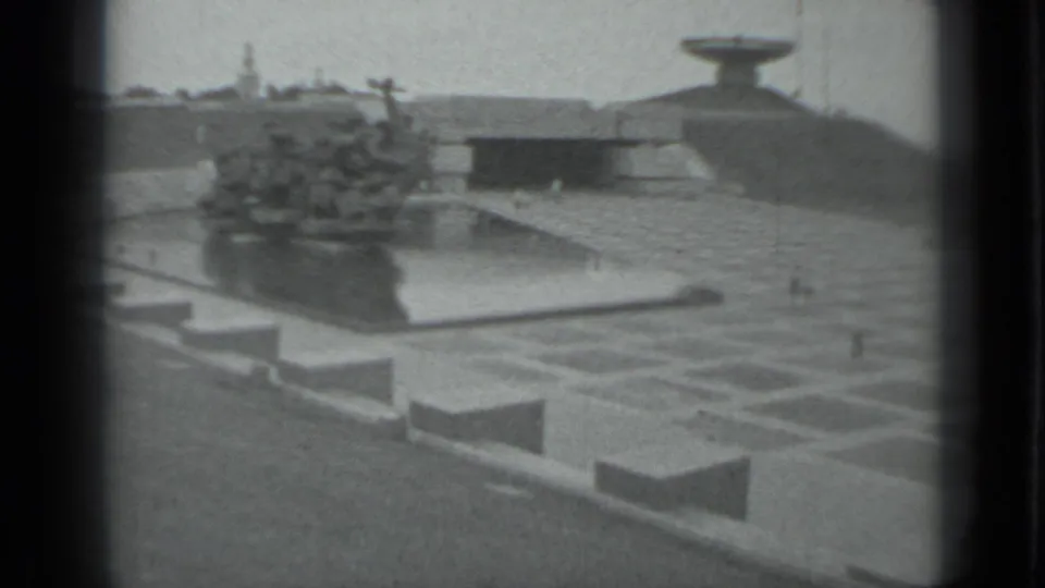 1983 8mm view in Moscow, Russia, showing a memorial plaza, central sculptural fountain, walkways, and distant monument forms.