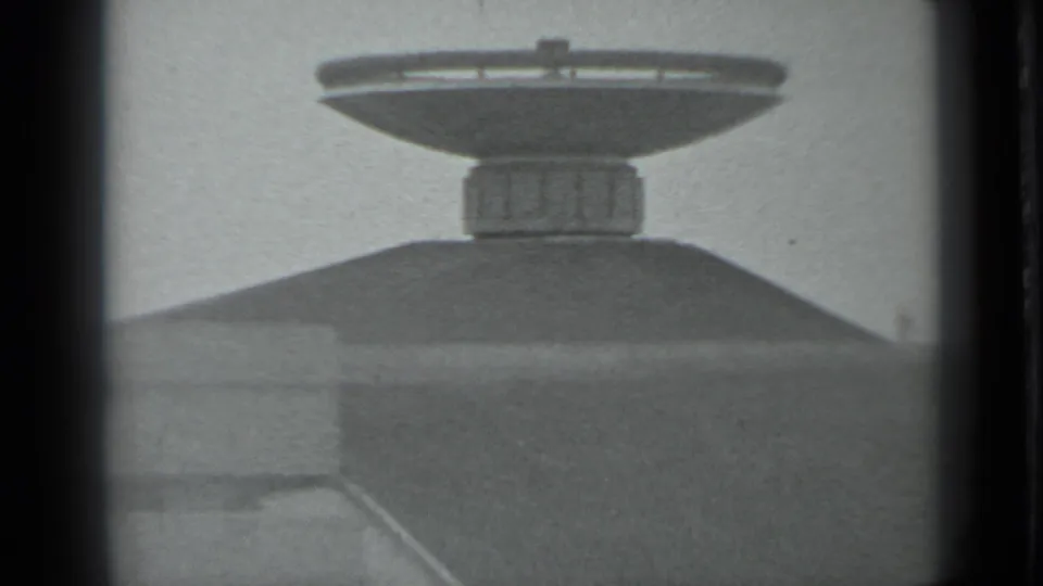 Closer 1983 8mm view of the memorial complex in Moscow, with a dish-shaped monument rising from a mound or platform.