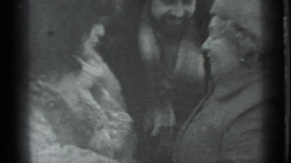 The final frame shows adults in close proximity during an affectionate exchange, consistent with the supplied Moscow 1983 home-movie metadata.