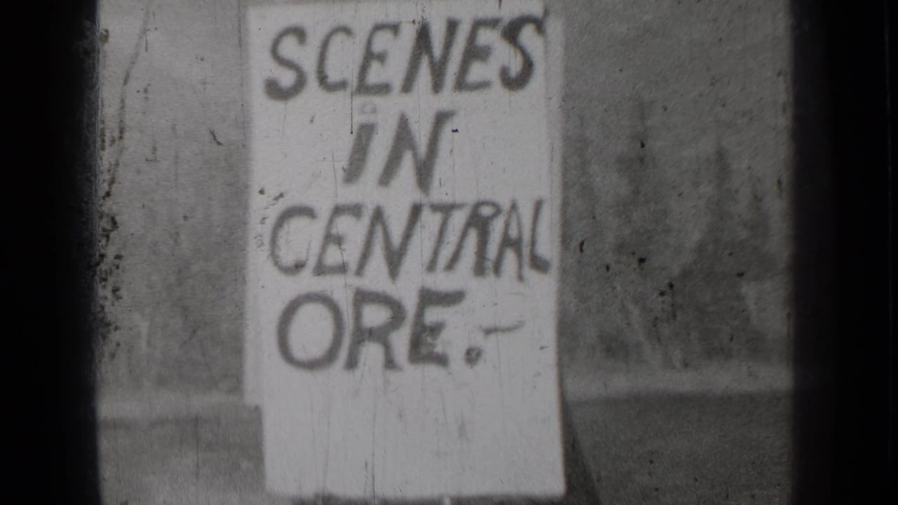 Second view of the SCENES IN CENTRAL ORE. sign with dark film edge and blurred background.