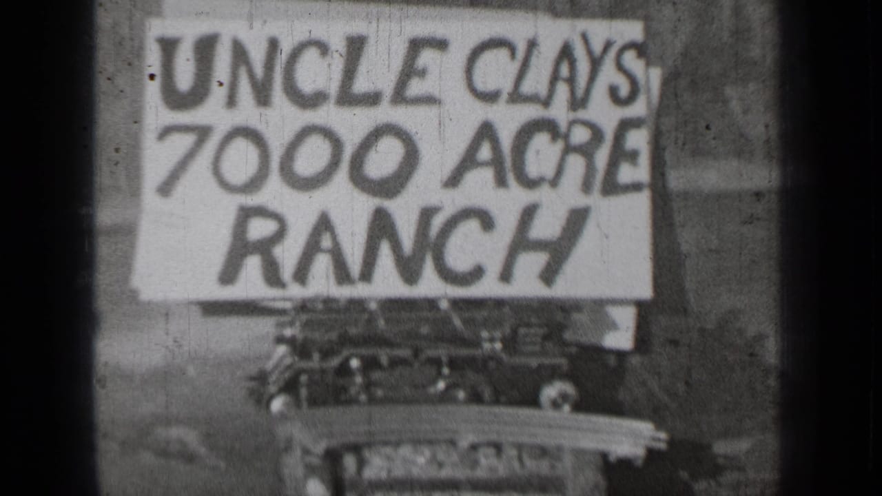 Hand-painted Uncle Clays 7000 Acre Ranch sign above a partially visible automobile.