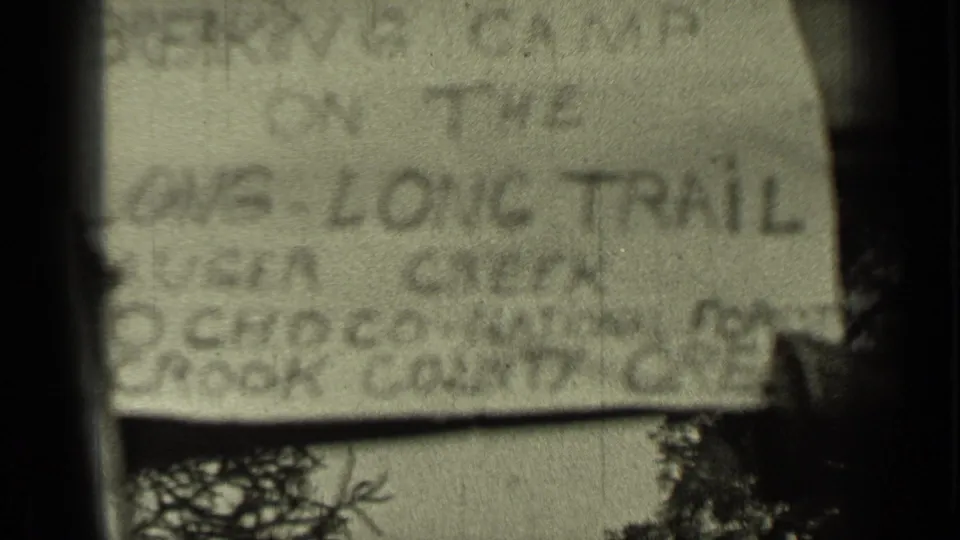 Soft 8mm frame of a handwritten title card for Bend, Oregon and the Long Trail, likely identifying the 1937 home-movie scene.