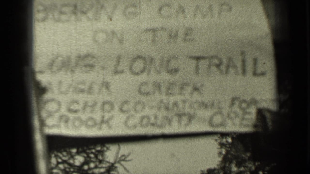 Second view of the handwritten title card with blurred location notes.