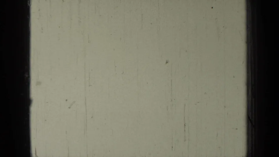 Opening 1937 8mm frame from Bend, Oregon footage, largely blank with dark gate edges, pale exposure, and visible film wear.